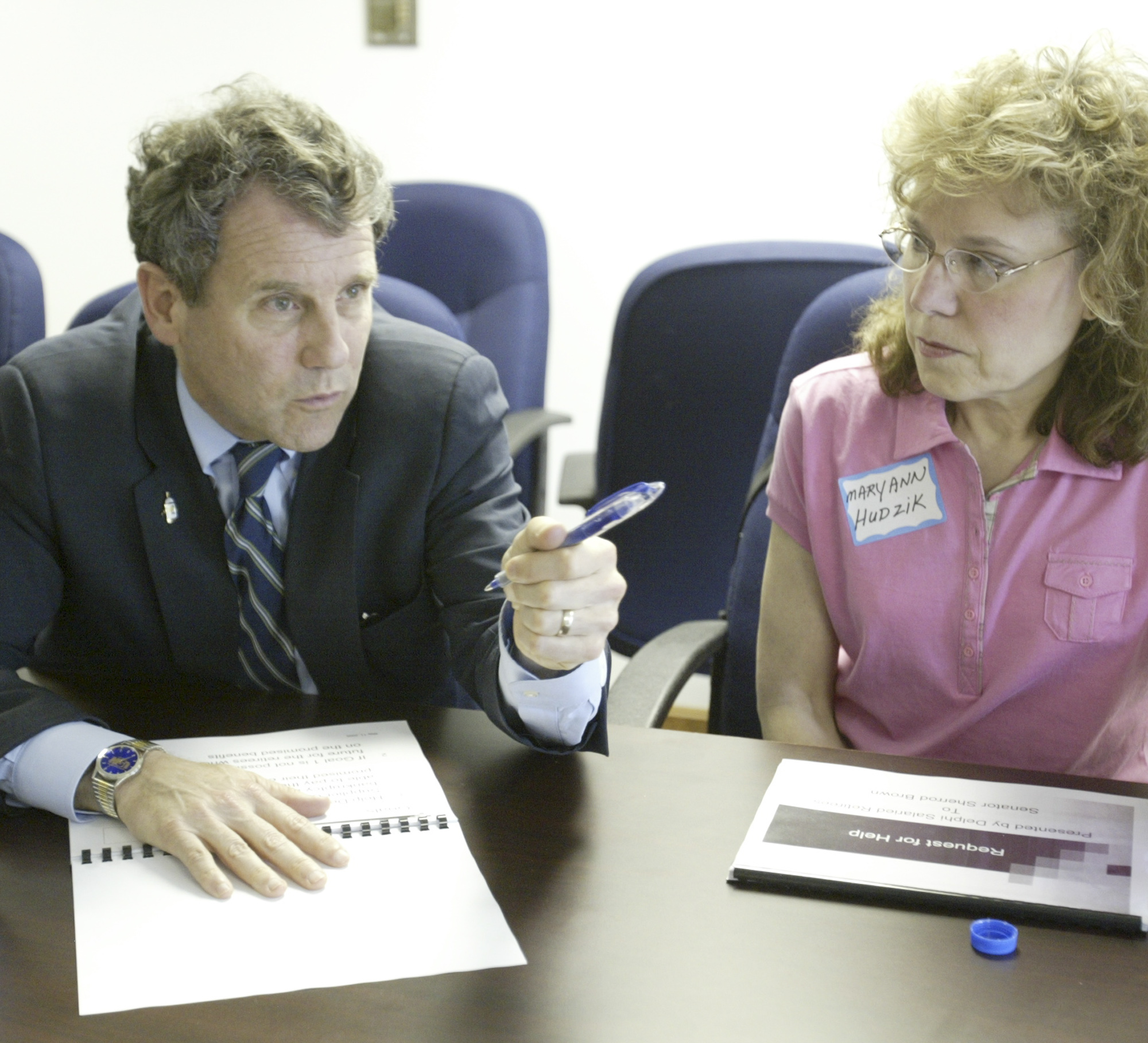 US Sen Sherrod Brown talks with Mary Hudzik of Warren, a member of Delphi Salaried Retirees Association, during a meeting concerning Delphi retirees benefits Monday at the UAW 1112 hall in Lordstown.