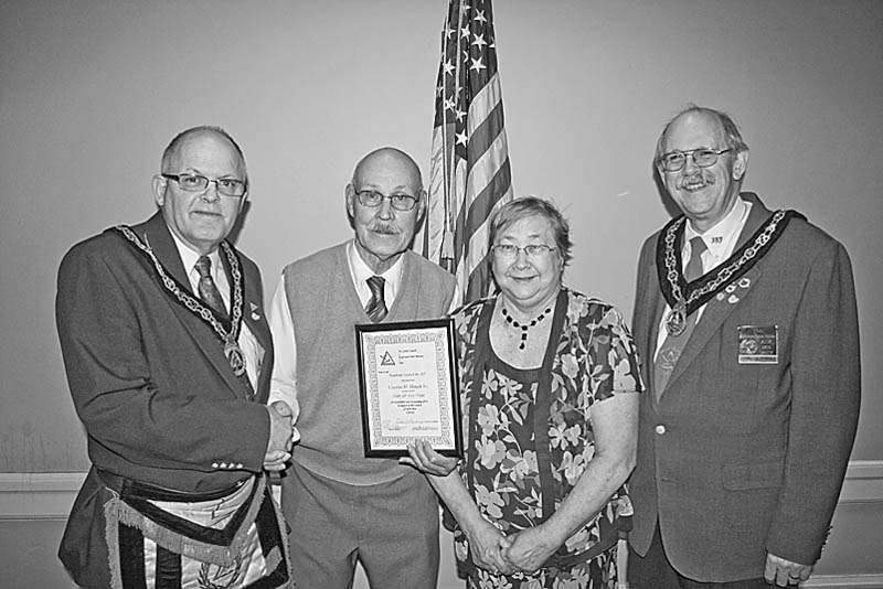 <p>Special to The Vindicator</p>
<p>PROUD MOMENT: A highlight of a recent meeting of the Grand Council of Royal and Select Masons of Ohio, Buechner Council 107, was the selection of Charles H. Houck Sr. as its “Man of the Year.” Sharing the proud moment with Houck, second from left, are, from left, Robert Rhinehart; Houck’s wife, Judy; and James Parker VI.</p>