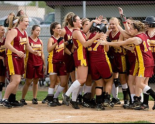 5.14.2009
Cardinal Mooney's Meg Williams (27) is congratulated by her teamates after hitting a homerun during the bottom of the second inning at Boardman's Field of Dreams on Thursday evening.
Geoffrey Hauschild