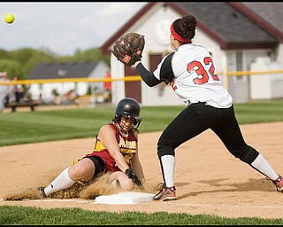 5.14.2009
Cardinal Mooney's Christina Hrehor (21) beats the throw to Canfield's Melanie West (32) landing safely at third base during the bottom of the fourth inning at Boardman's Field of Dreams on Thursday evening.
Geoffrey Hauschild