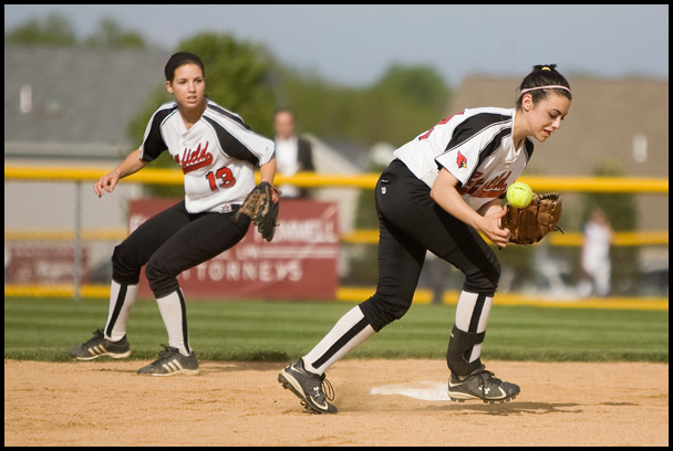 5.14.2009
Canfield's Gina Mancini (24) goes after a bobbled ball in front of teamate Cara Cupler (13) during the bottom of the fifth inning at Boardman's Field of Dreams on Thursday evening.
Geoffrey Hauschild
