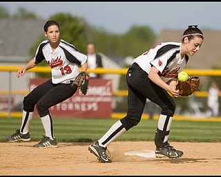 5.14.2009
Canfield's Gina Mancini (24) goes after a bobbled ball in front of teamate Cara Cupler (13) during the bottom of the fifth inning at Boardman's Field of Dreams on Thursday evening.
Geoffrey Hauschild