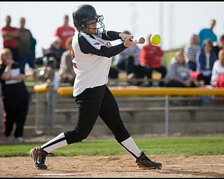 5.14.2009
Canfield's Melanie West (32) makes contact during the top of the seventh inning at Boardman's Field of Dreams on Thursday evening.
Geoffrey Hauschild