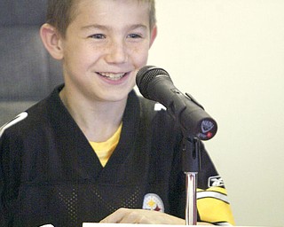 LEARNING THE RULES: John Popa, a South Range Elementary School third grader, became Beaver Township’s temporary zoning inspector as students assumed the roles of township officials during a mock trustees’ meeting Friday. The visit to the township administrative offices was an educational experience for the children.
