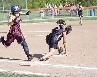 South Range Emily Seman (32) gets out by Springfield Rebecca Evan (3) at first base during the first inning Friday.