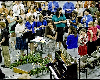 Howland band director Nancy Moore gets a standing ovation at the last concert of Moore's career. She will be retiring at the end of the year. Tuesday May 12, 2009