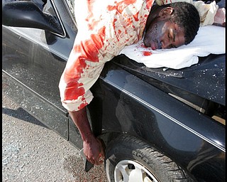 5.12.2009
New Castle HS senior Ta'Shan Jones was one of several students at the school who portrayed accident victims during a mock prom night accident at the school Tuesday morning. The mock acident was to demonstrate the dangers of drinking and driving .