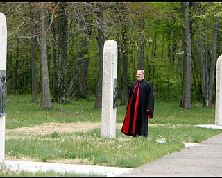 5.13.2009
Monsignor Spinoza stands by one of the new stations of the cross at the North Jackson National Shrine of Our Lady of Lebanon.
