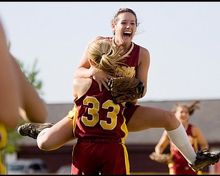 5.14.2009
Cardinal Mooney's Cadi Sheffler (11) leaps into the arms of Shayla Decapita (33) after defeating Canfield in softball at Boardman's Field of Dreams on Thursday evening.