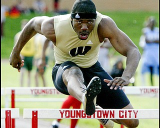 5.14.2009
CLEARING A HURDLE:
Harding's Marvin Logan competes in a semifinal of the 110-meter hurdles during Thursday's SVC track meet at Chaney High School. Logan later won the final with a time of 14.70 to help the Raiders win the team title.