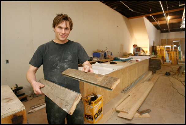 The Lemon Grove, the café opening mid-June in downtown 
Youngstown, will be open to press. Jacob Harver, the proprietor of the The Lemon Grove, a cafe under construction in downtown Youngstown, displays construction materials for the interior floor and bar that were salvaged from a 160 year old barn from Brookfield, OH.
 