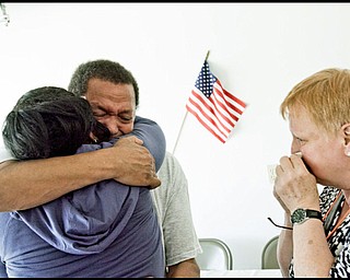 5.16.2009
William Gillett, a Belgian "war baby" embraces his half-sister Shirley Torres for the first time while his wife Christine wipes her face. Gillett, a native of Belgian was born during WWII to a Youngstown soldier, Gilbert Stephens. Stephens had wanted to bring Gillett and his mother back to the U.S. but Gillet's maternal grandmother would not allow it. Gillet discovered the identity of his father 7 years ago but was never able to meet him as he passed away in 1990.