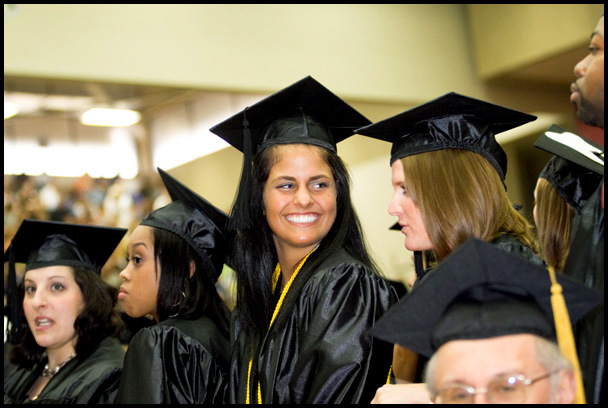 Students stand to accept their degrees during Youngstown State University's Undergraduate Commencement, Saturday May 16, 2009.
