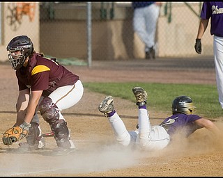 5.19.2009
South Range's Chris Gause waits for the throw
while Champion's Rick Yauger scores the final run for the flashes in the bottom of the fith inning at Cene Park on Tuesday evening. Yauger's run brought the final score to 13-3 Champion.
Geoffrey Hauschild