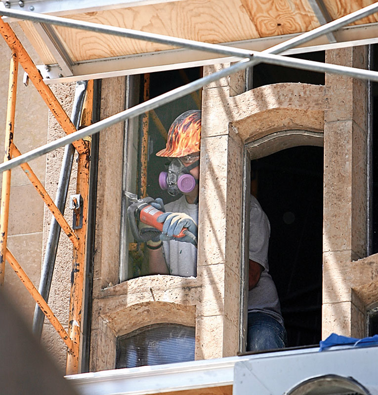 Steve Yates of Kansas and Bovard Studio Inc, of Iowa.. works on the grout as the stained glass windows are removed - and restored and replaced - at the Cathedral on Wood St.
