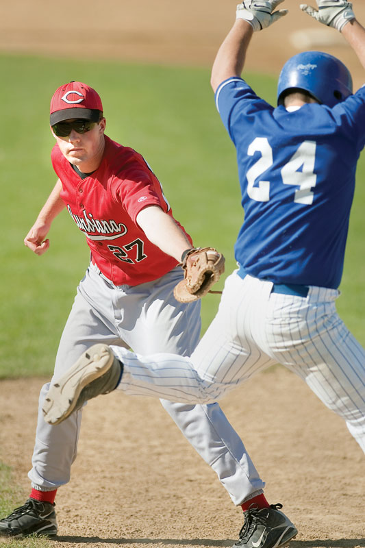 Columbiana's (27) Jay Williamson attempts to tag McDonald's Anthony Raschilla (24) on his way to first base during the bottom of the third inning at Cene Field on Wednesday afternoon. Raschilla was called out at first ending the inning.