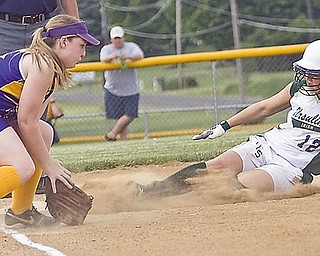 Ursuline Kasey Foley (18) slides into 3rd base to be safe when Champion Megan Frantz (30) can't get her out in the 2nd inning at Friday's game in Lisbon, May 22, 2009.
