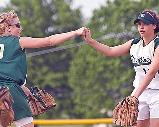 Ursuline's Anna Donko (20) and Miranda Carkido (15) at the Friday game in Lisbon against Champion, May 22, 2009.