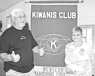 Special to The Vindicator
THUMBS UP: Featured at the April 29 meeting of Kiwanis Club of Western Mahoning County were talks by Barry Silliphant and Linda Hrenko, Kiwanis members from Newton Falls. The two volunteer their time and money to make trips with the Santa Good Will Tours to orphanages, hospitals, schools, special needs groups, and senior citizen homes throughout the world. Silliphant gives a thumbs-up gesture to show his approval of the tours, which are backed by Pioneers, a corporate volunteer organization. It has given him the opportunity to play Santa for the past eight years. The local Kiwanis Club donated money for gifts, which Silliphant and Hrenko distributed to more than 300 children during a trip to Peru in November. Speaker at the May 13 meeting was John Stoll, local FBI agent. Members of Canfield Key Club will be featured at the May 27 meeting. For more information call (330) 538-3041.