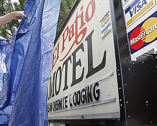 CLOSED: El Patio Motel, on U.S. Route 224, was boarded and padlocked Wednesday by Canfield police. Tenants were cleared out by police after a Mahoning County Common Pleas Court magistrate granted a temporary restraining order to the city, authorizing the business to be closed. Police have investigated repeated reports of criminal activity at the motel.