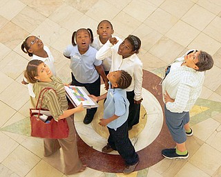 The Center for Urban Studies' Rachel Dodato, bottom left, looks at the rotunda with, clockwise from right, Rayvanne Bennett, Shamya Williams, Taia Wright, Tionia Wallace, Dawon Townsend and and their teacher Mrs. Sylvia Busby.