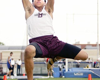 Boardman's Caleb Matthews competes in the long jump Wednesday at Austintown Fitch.