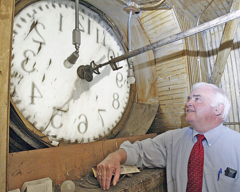 Columbiana County Commissioner Jim Hoppel inspects the inside of the courthouse clock.  Efforts are underway to repair and restore the clock atop the historic Columbiana County Courthouse in downtown Lisbon. 