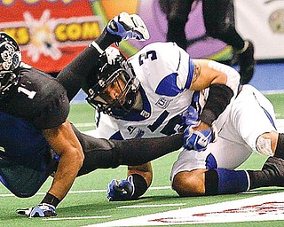 Thunder Quorey Payne (1) gets tripped up by Kentucky Horsemen J.T. Haskins (3) at Covelli Centre, Saturday May 30, 2009.