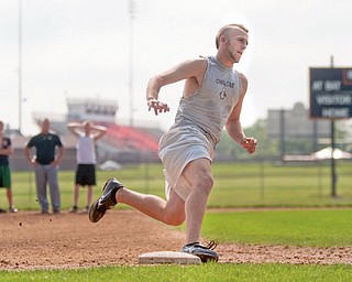 Pitcher, Todd Kibby, runs the bases during practice at Springfield High School on Tuesday evening.