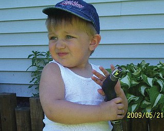JUSTIN BISH of Hubbard, who will turn 2 on Tuesday, posed for his grandmother, Pam Filo of Hubbard.