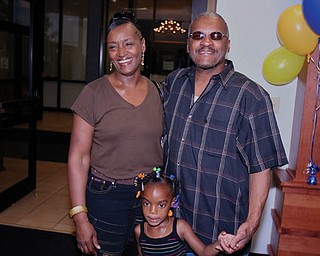 This is a photo of DWAYNE AND MARY WILLIAMSON of Warren with their granddaughter.