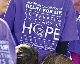 Cancer survivor Patti Brukell of Austintown holds 2 of her 4 children who helped her pull through Chemo, Lillian (6) and Elizabeth (4) during opening commencement at Austintown Relay for Life,