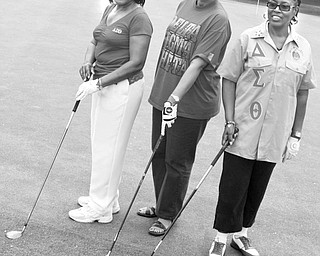 <p>The Vindicator/Lisa-Ann Ishihara</p>
<p>Decisions, decisions: The problem of deciding which club they will rely on when competing in the Red and White Scholarship Scramble on June 20 is solved by, from left, Agnes Kimbrough, Camille Pinkard and Octavia Payne, Delta Sigma Theta committee members, who display their favorite clubs as they prepare for a practice round.</p>
