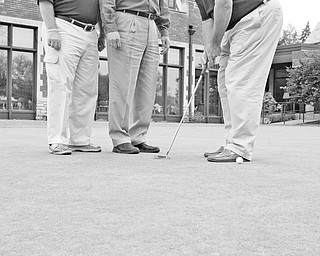 <p>The Vindicator/William D. Lewis</p>
<p>GOOD SHOT: With preparations completed for the American Heart Association’s 2009 Golf Classic Scramble on June 15 at Youngstown Country Club, Kevin McGuire, event sponsor, left, and Joe Valvo, event cochairman, take time to admire the technique of Mike Burley, cochairman, as he sinks a putt while practicing for the event.</p>