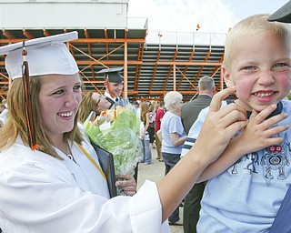 Springfield grad Laura Krcelic greets her nephew Brian Krcelic, 4, after Sunday commencement.