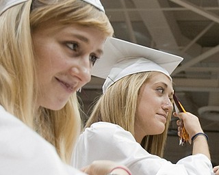 6.7.2009
Boardman graduates, Sarah Elizabeth DelliQuadri and Taylor Elizabeth Deley move their tassels to the left of their cap during Boardman's commencement ceremony at Boardman High School on Sunday afternoon.
Geoffrey Hauschild