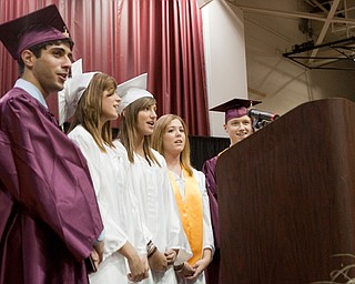 6.7.2009
Emile Toni Boulos, Kayleena May Kinnick, Erika Lynn Sebastian, Mary Margaret Newland, and Jon Dale Gluckner II join together in singing the school's Alma Mater during Boardman's commencement ceremony at Boardman High School on Sunday afternoon.
Geoffrey Hauschild