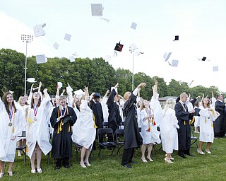 Springfield grads toss their caps  during Sunday commencement.