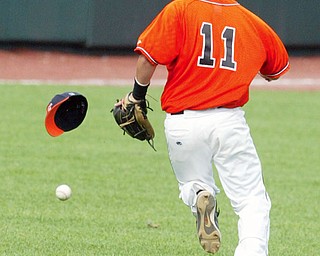Springfield's Ronnie Bovo loseshis hat while trying to run down a hit off the bat of Patrick Henry's Austinton Bower.