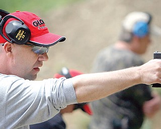 Sgt. Chris Moffitt of Hubbard trains with his Glock at the Hubbard Police Dept. Training Grounds