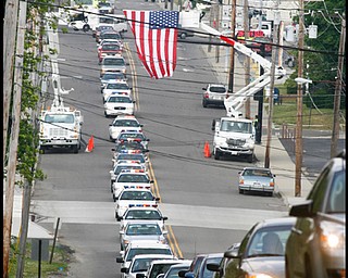 The City of Hubbard pays tribute to Army Chief Warrant Officer S Blane Hepfner as his funeral procession travels along Liberty St in Hubbard.