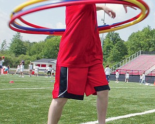 A C.H. Campbell 4th grader hula hoops during end of year field day Tuesday at Canfield High School. Students from C.H. Campbell and Hilltop participated in the event.