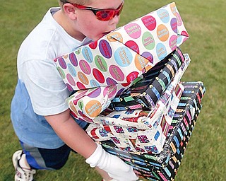 Fifth grader Alex Weimer balances packages in a relay race at Poland North Elementary.