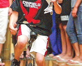 Canfield Middle School student CJ Frost rode a unicycle in the schools talent show Thursday