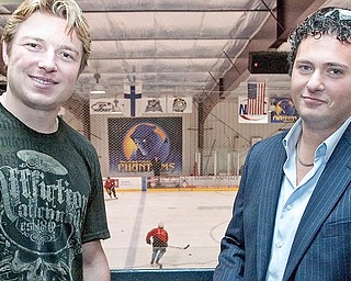 Pittsburgh Penguin, Ruslan Fedotenko, and Youngstown Phantoms President, Alex Zoldan, pose for a photograph at the Ice Zone while Fedotenko's two step-sons Derek and Larkin Jacobson tryout for a spot on the Youngstown Phantoms.