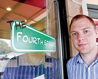 Fourth Street Cafe owner Evan Egli outside his business.