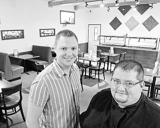 Fourth Street Cafe owner Evan Egli, left, and Chef Stephen Grant in dinging room at the Salem Eatery. The restuarant recently opened WD LEWIS