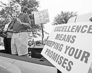Chuck Cunningham, former senior executive at Delphi Packard Electric, who with his wife, Mary Ann, also a retired Delphi executive, at the Delphi Salaried retirees rally at the Larchmont Plant in Warren.