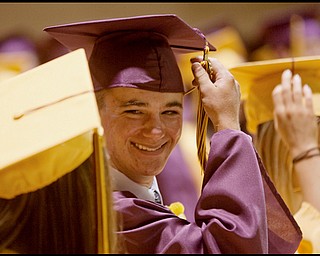 6.13.2009
Wade Wince moves the tassel on his mortarboard from one side to the other signifying his graduation during the South Range commencement ceremony in the school's gymnasium on Saturday afternoon.