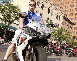 Rosetta Stone owner Greg Sop on his Suzuki GSXR down West Federal Plaza for "Rally in the Valley"  Sunday June 14, 2009

Lisa-Ann Ishihara